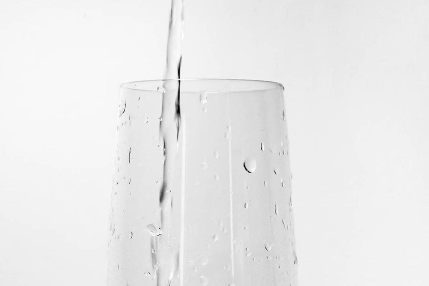 Pouring water into a glass